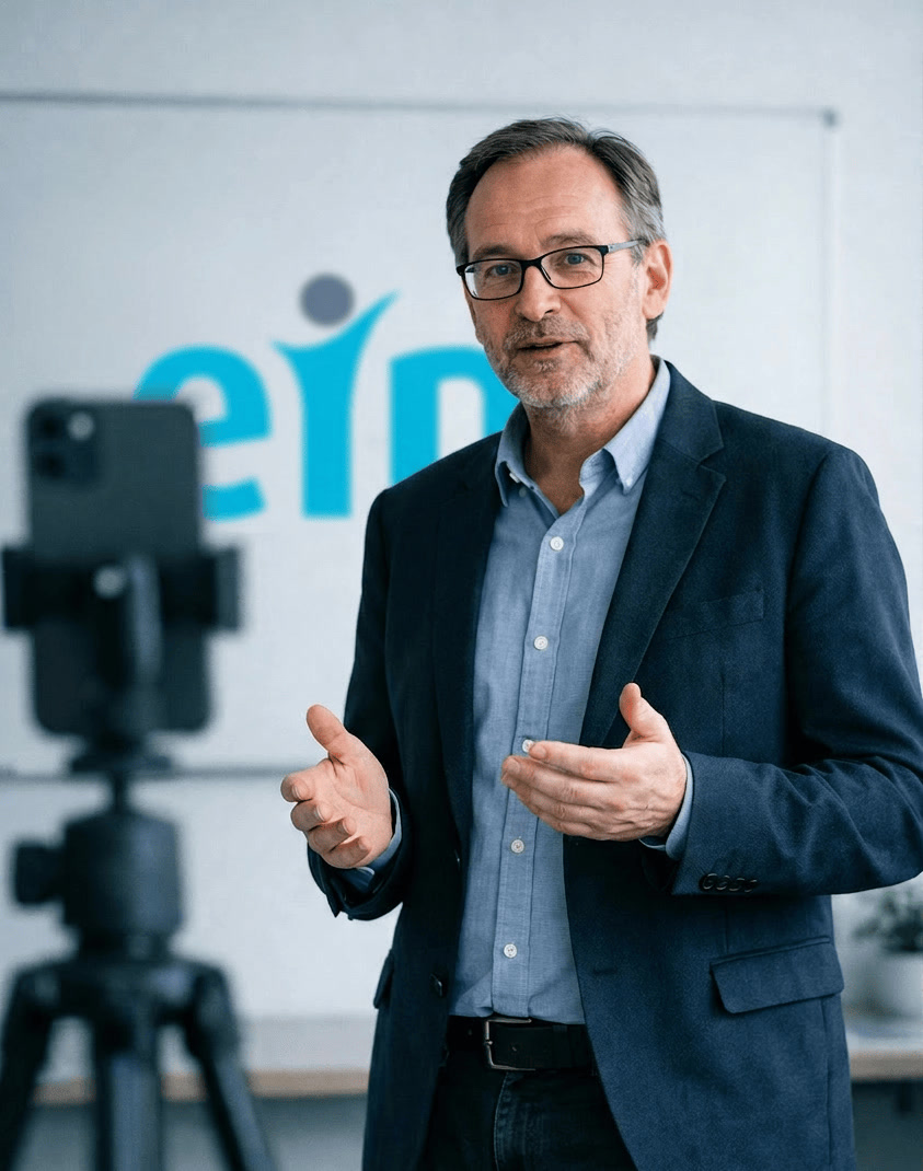 Professor Speaking to Camera With Blurred Video Camera Foreground